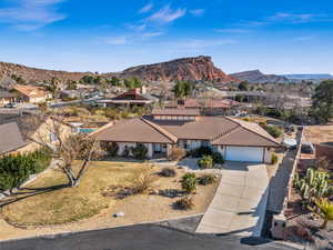 Ranch-style home featuring a mountain view and a garage