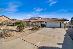 View of front of home featuring a garage