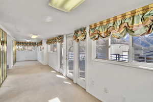 Hallway with light colored carpet