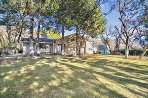 View of front of house with a front lawn