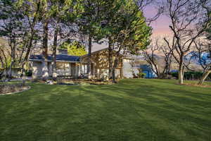 View of front of house featuring a yard