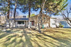 View of front of property featuring a front lawn