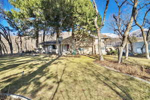 View of front of house with a front yard