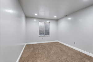 View of carpeted spare room