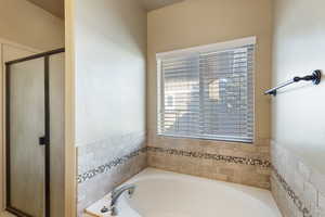 Bathroom with plus walk in shower
