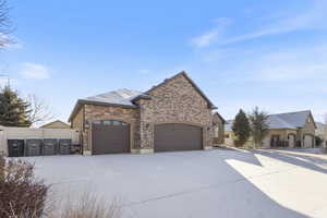 View of property exterior with a garage