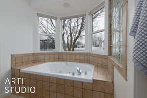 Bathroom featuring tiled tub