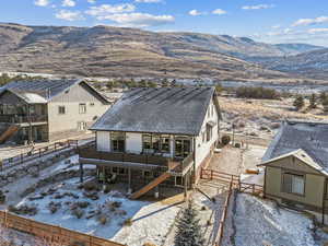 Exterior space featuring a deck with mountain view