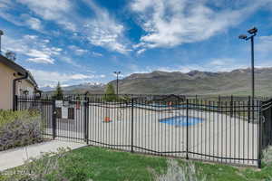 View of pool with a mountain view