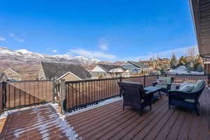 Wooden deck featuring a mountain view