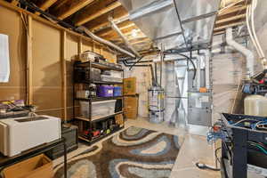 Basement featuring gas water heater