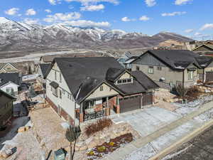 View of front of house with a mountain view and a garage