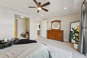 Carpeted bedroom with ceiling fan