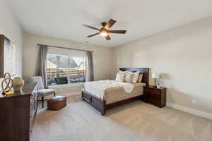 Bedroom featuring ceiling fan and light carpet