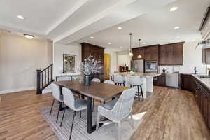 Dining room with light hardwood / wood-style flooring