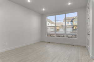 Empty room with light wood-type flooring