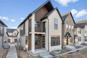 View of front of house with central air condition unit