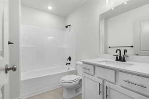 Full bathroom with vanity, toilet, and bathing tub / shower combination