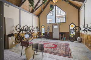 Interior space featuring wood ceiling and lofted ceiling with beams