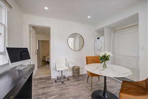 Dining area with hardwood / wood-style floors