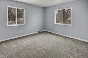 Empty room featuring carpet floors