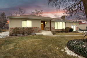 View of front of property featuring a yard