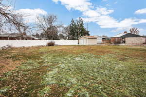 View of yard featuring a garage