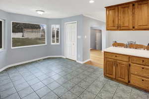 Kitchen with light tile patterned floors