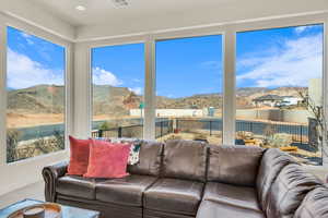 Sunroom featuring visible vents and a mountain view