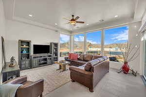 Living area featuring recessed lighting, light tile patterned floors, visible vents, and a ceiling fan