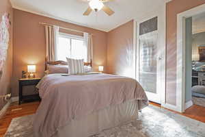 Bedroom with light hardwood / wood-style floors and ceiling fan