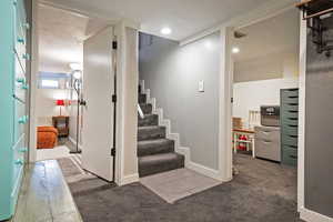 Stairs featuring carpet flooring