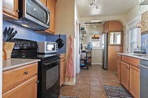 Kitchen with stainless steel appliances, tasteful backsplash, plenty of natural light, and sink