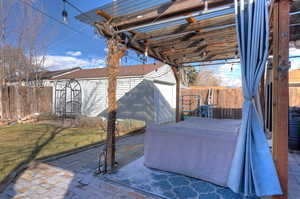 View of patio / terrace with an outbuilding and a garage