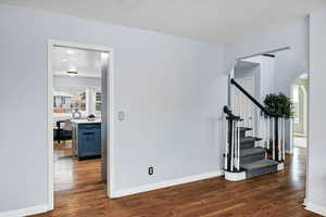 Interior space with wood-type flooring and a textured ceiling