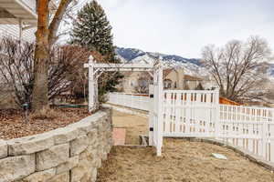 View of gate featuring a mountain view