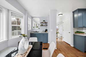 Dining area featuring sink and light hardwood / wood-style flooring