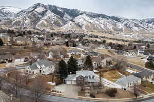 Snowy aerial view featuring a mountain view