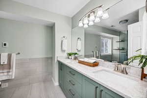 Bathroom with vanity and an enclosed shower