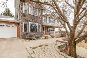 View of front facade featuring a garage and covered porch