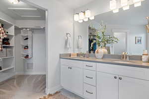 Double sinks to help keep the peace and the walking primary closet.