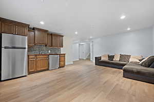 Open floor plan in the basement. Custom cabinetry and new flooring.