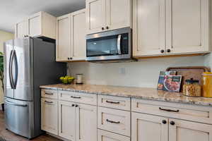 Lots of counter space to prep your meals on these beautiful granite countertops.