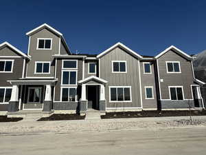 View of front of house featuring board and batten siding