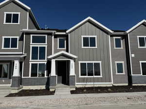 Townhome / multi-family property featuring board and batten siding