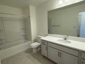 Bathroom featuring bathing tub / shower combination, vanity, toilet, and tile patterned floors