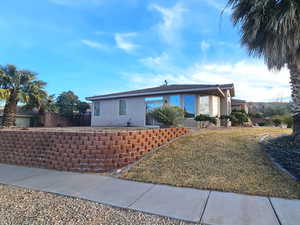 Ranch-style home with a front yard