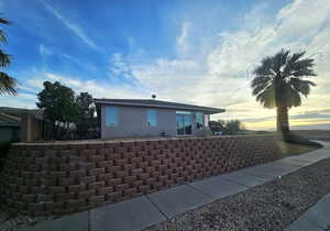 View of property exterior at dusk