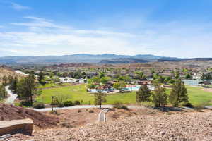 Property view of mountains with a residential view