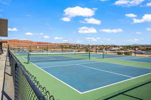 View of tennis court featuring a mountain view